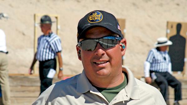 US Border Patrol Agent Participates in a Competition at an Outdoor Range